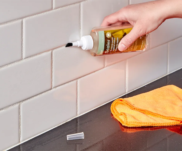 Professional grout sealing service protecting tiled surfaces